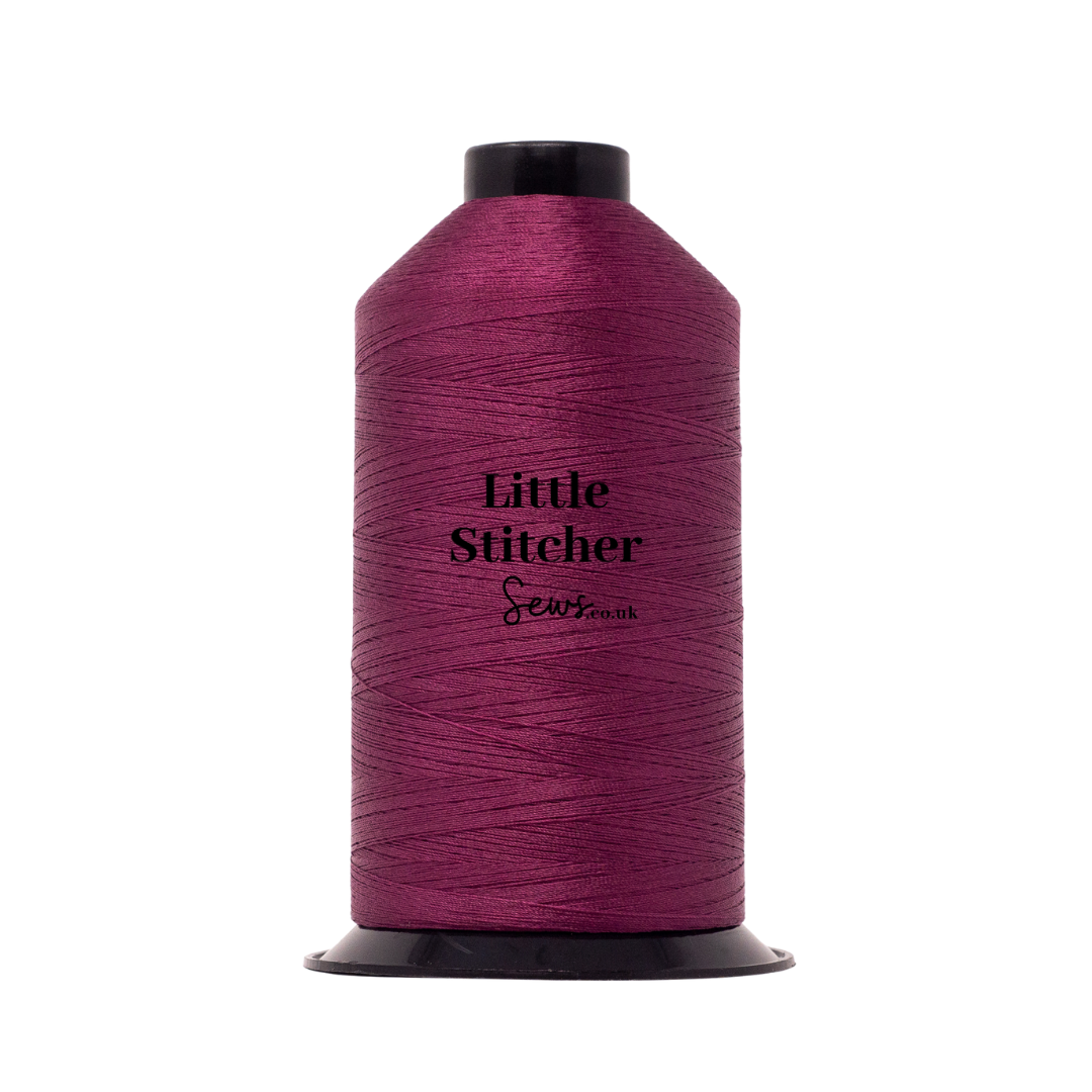 Spool of berry thread with 'Little Stitcher Sews' branding on a white background