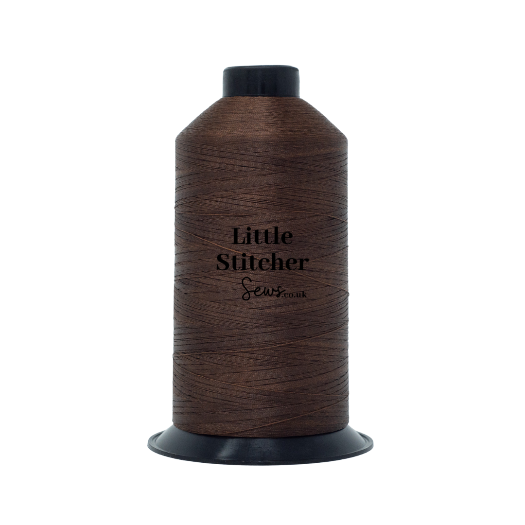 Spool of brown thread with 'Little Stitcher Sews' branding on a white background