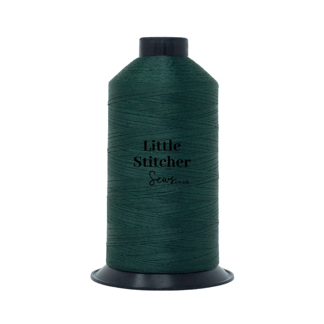 Spool of forest green thread with 'Little Stitcher Sews' branding on a white background
