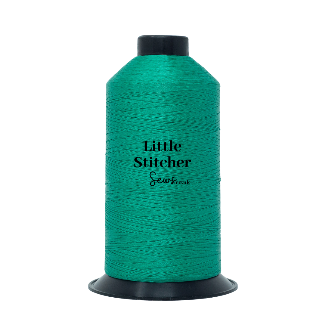 Spool of jade thread with 'Little Stitcher Sews' branding on a white background