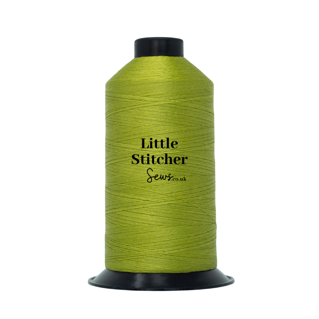 Spool of lime thread with 'Little Stitcher Sews' branding on a white background