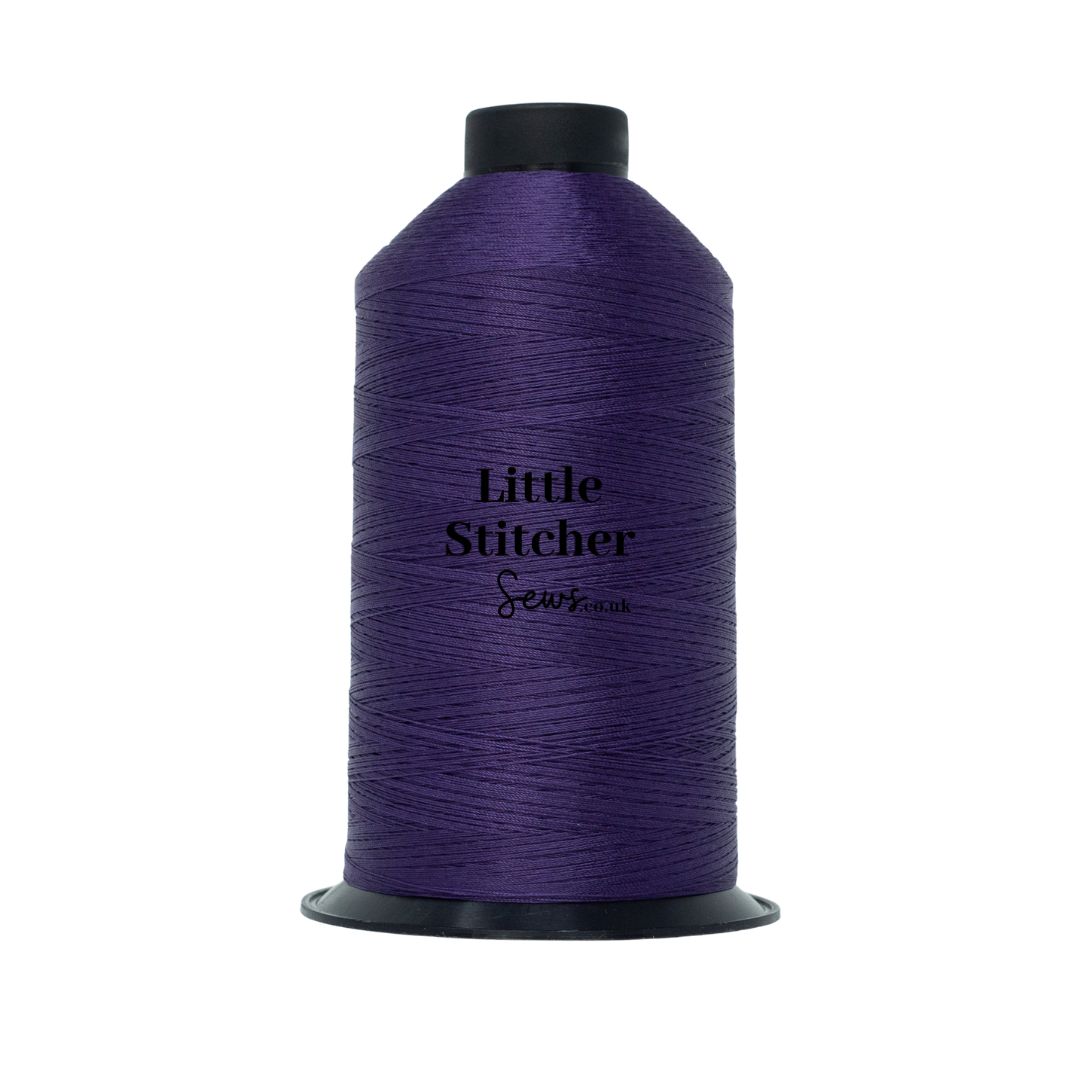 Spool of purple thread with 'Little Stitcher Sews' branding on a white background