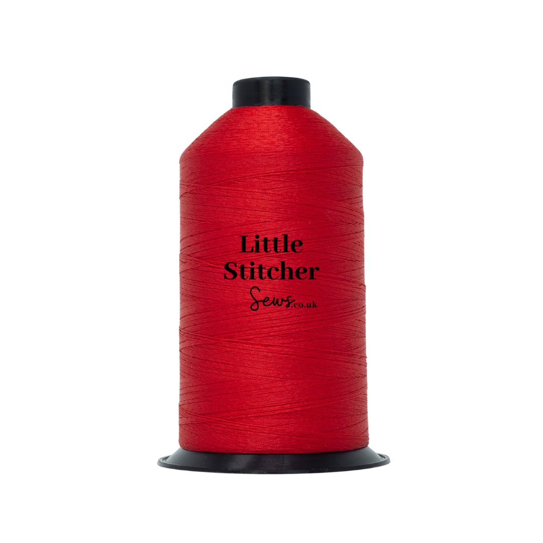 Spool of red thread with 'Little Stitcher Sews' branding on a white background