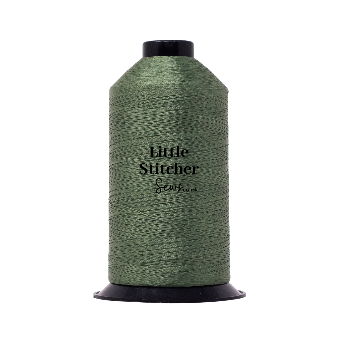 Spool of sage thread with 'Little Stitcher Sews' branding on a white background