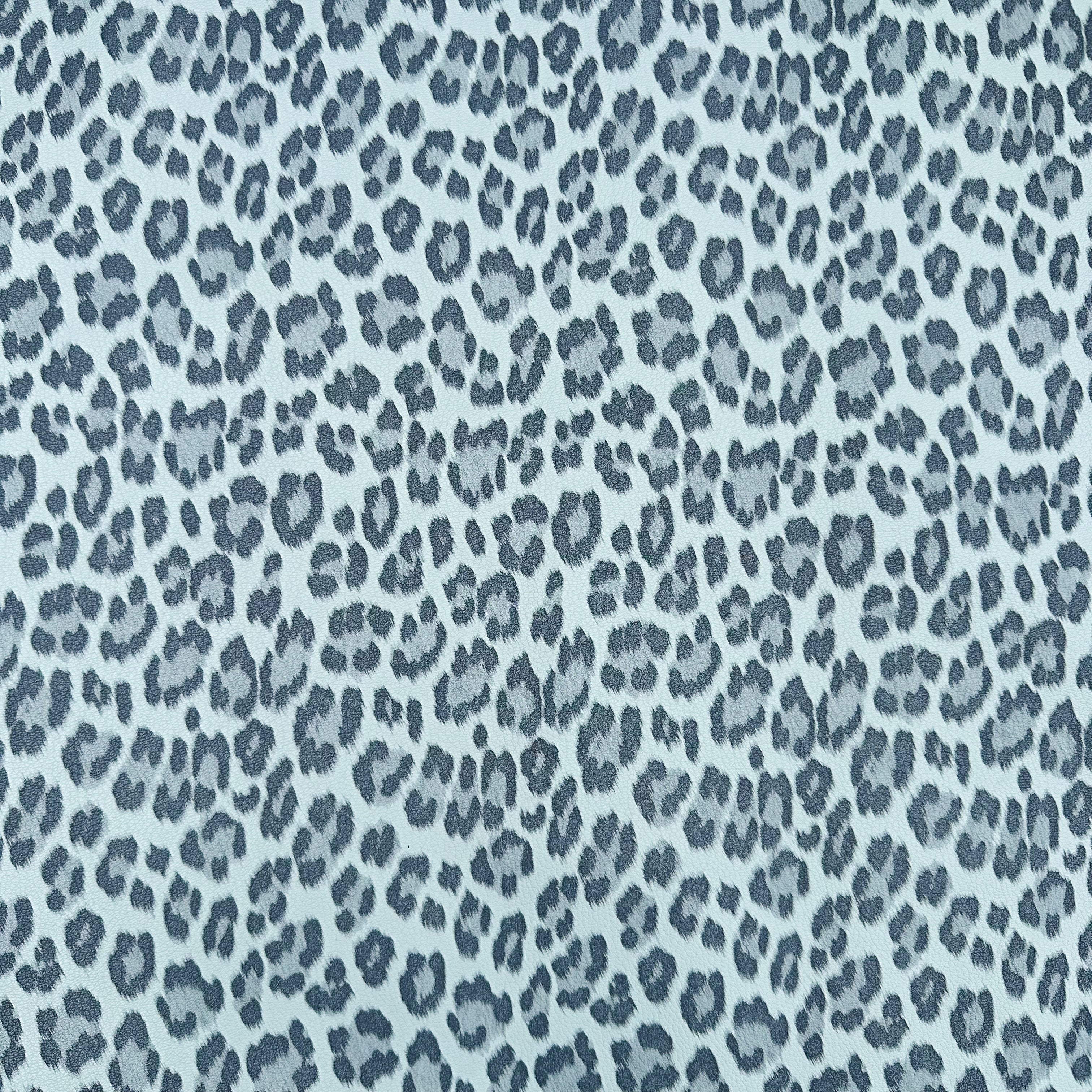 Leopard print pattern in blue on a light blue background