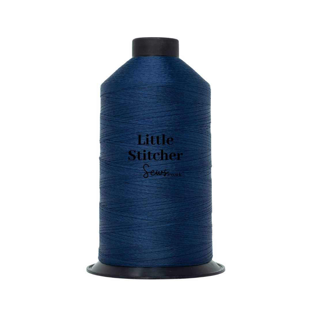 Spool of navy thread with 'Little Stitcher Sews' branding on a white background
