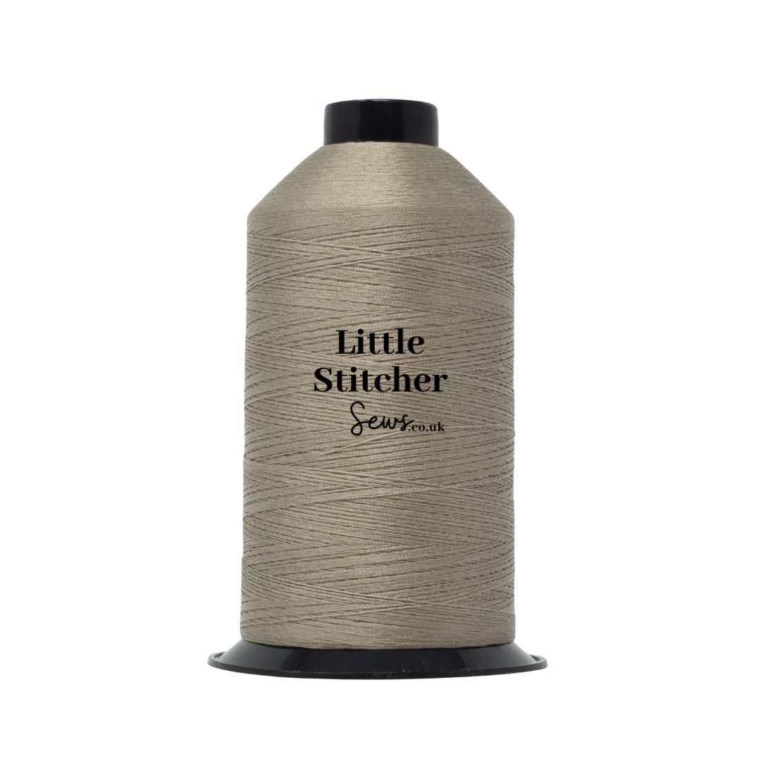 Spool of sandstone thread with 'Little Stitcher Sews' branding on a white background